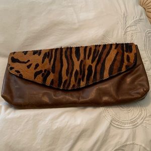 Tiger and leather clutch